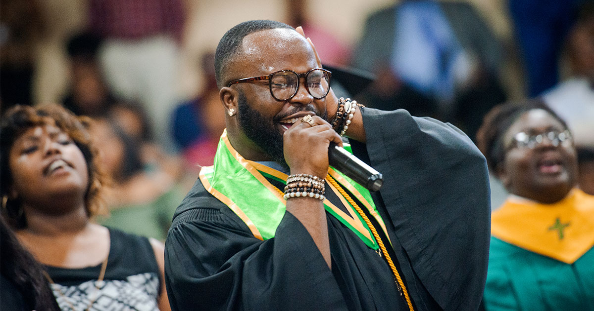 Linzell Tucker leads the choir on Saturday, April 28, during Concordia College Alabama’s commencement ceremony in the Julius and Mary Jenkins Center in Selma, Ala. (LCMS/Erik M. Lunsford)