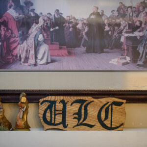 A woodcut of University Lutheran Chapel and a reproduction of a painting with Martin Luther are displayed at the Luther House in Minneapolis. (LCMS/Erik M. Lunsford)