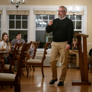 The Rev. David Kind, pastor of University Lutheran Chapel, leads table talk with his congregation following dinner at the Luther House in Minneapolis on Feb. 21, 2018. (LCMS/Erik M. Lunsford)