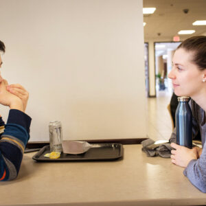 LCMS national missionary Rebecca Wagner talks with Juncheng, a Chinese student studying philosophy, on Feb. 21, 2018, at the University of Minnesota in Minneapolis. (LCMS/Erik M. Lunsford)