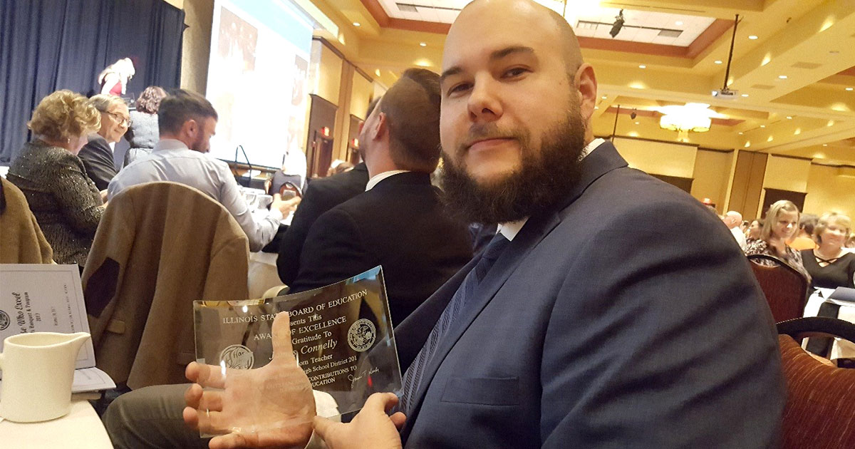 James Connelly, an industrial technology teacher at Morton West High School in Berwyn, Ill., holds his Award of Excellence. A 2017 graduate of Concordia University Chicago, River Forest, Ill., Connelly was named as one of 10 Illinois “Teacher of the Year” finalists for 2018 in recognition of his “outstanding contributions to Illinois education.” (Janelly Corona)