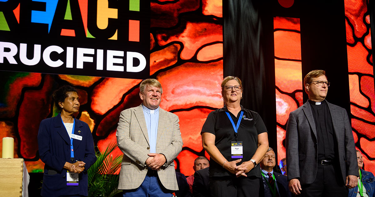 Deaconess Grace Rao, the Rev. Don Hougard, Sheryl Dewitt and the Rev. Joe Glombicki — all Million Dollar Life Match grant recipients — are recognized onstage on July 30 during the 68th Regular Convention of The Lutheran Church—Missouri Synod. (LCMS/Frank Kohn)
