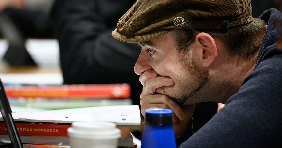 A convention delegate studies an issue of Today’s Business during the LCMS convention on July 31. (LCMS/Frank Kohn)