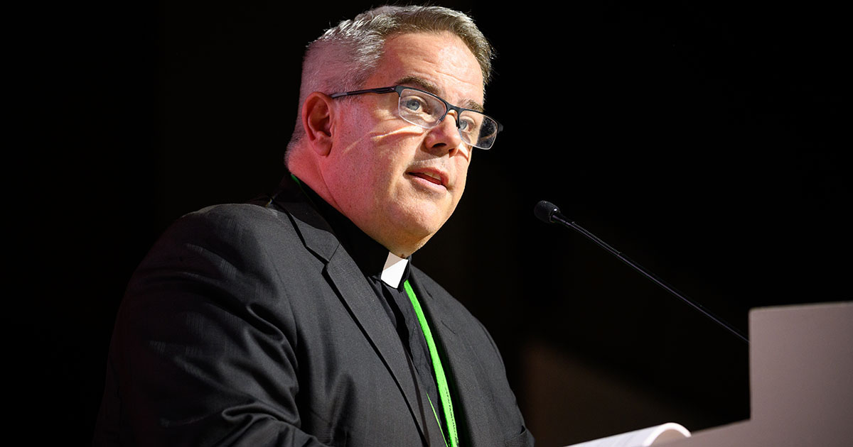 LCMS Missouri District President Rev. Dr. R. Lee Hagan, chairman of Floor Committee 2 on International Witness, speaks to the delegates on Aug. 1 at the 68th Regular Convention of The Lutheran Church—Missouri Synod. (LCMS/Roy S. Askins)