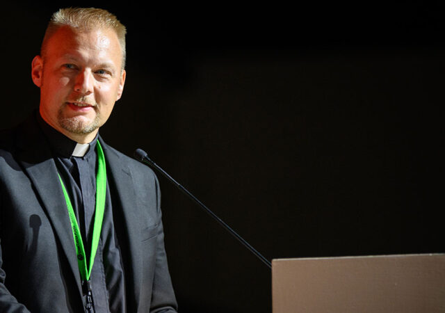 On Tuesday, Aug. 1, at the 68th Regular Convention of The Lutheran Church—Missouri Synod, Floor Committee (FC) 3 Chairman Rev. Brady Finnern introduces a resolution to raise awareness of the magnitude of the problem of human trafficking. (LCMS/Erik M. Lunsford)