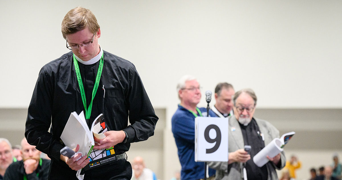 Delegates queue to speak to Res. 4-06 on Thursday, Aug. 3, on the floor of the 68th Regular Convention of The Lutheran Church—Missouri Synod (LCMS) in Milwaukee. (LCMS/Erik M. Lunsford)