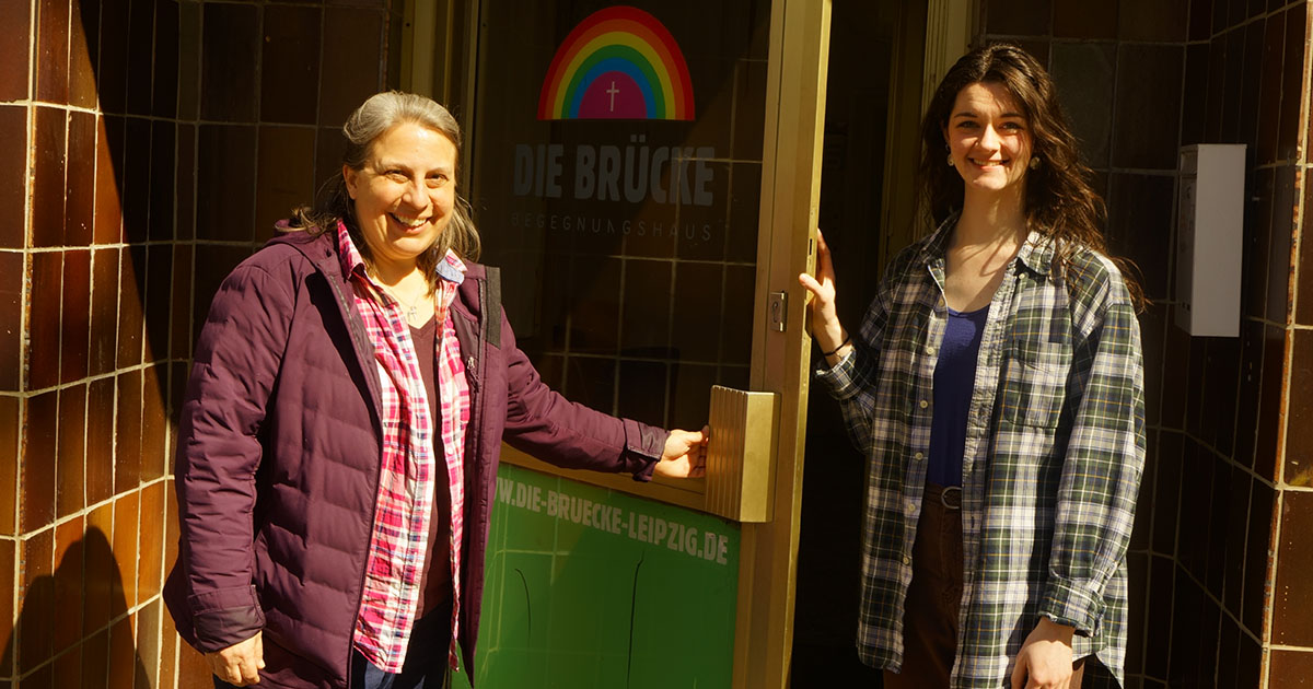 Deaconess Kim Bueltmann (left) and Deaconess Intern Anika Slayton, LCMS missionaries to Germany, stand outside the front door of Die Brücke, a Lutheran mission outreach center in Leipzig. (Photo courtesy of Anika Slayton)