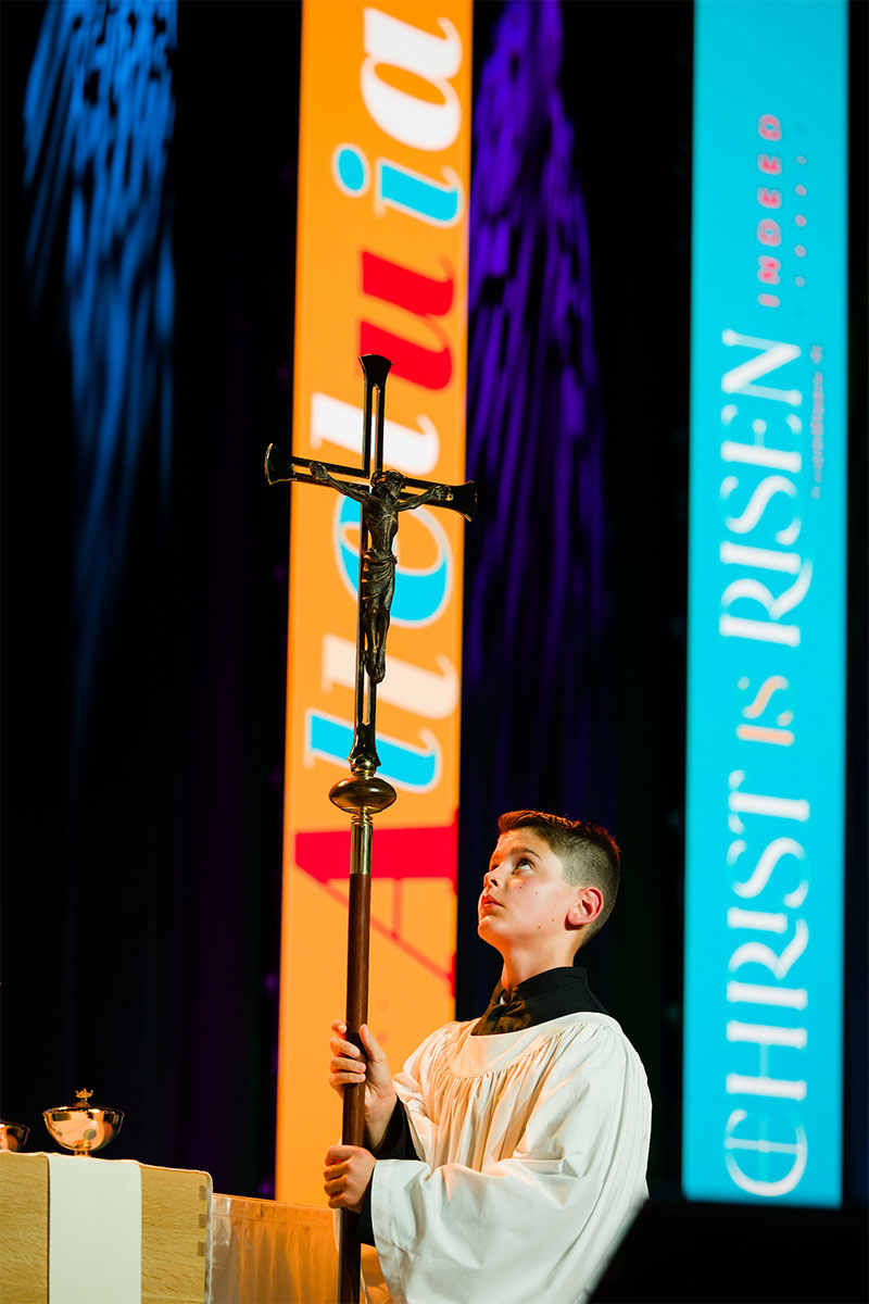 Theodore Schultz from Redeemer Lutheran Church, Fort Wayne, Ind. serves as crucifer during the Opening Divine Service for the 2026 LCMS convention. (LCMS/Erik M. Lunsford)