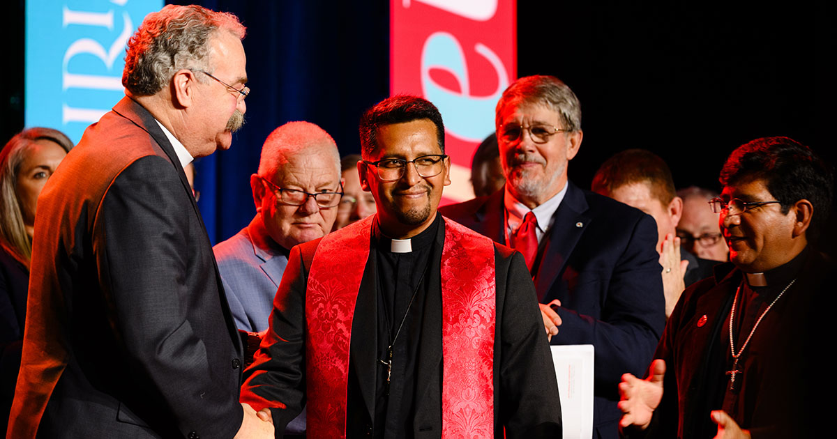 The Rev. Dr. Matthew C. Harrison, LCMS president, shakes hands with President Limberth Fernandez Coronado of the Evangelical Lutheran Christian Church of Bolivia upon declaring altar and pulpit fellowship during the 69th Regular Convention of The Lutheran Church—Missouri Synod on July 21 in Phoenix. (LCMS/Erik M. Lunsford)