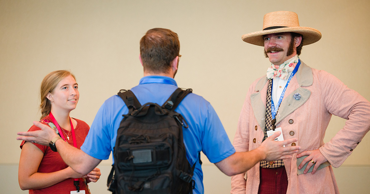 Lukas Sollberger (right) talks with Miriam Kieser (left) and Zachary Staehr (center) on July 18 during the 69th Regular Convention of The Lutheran Church—Missouri Synod in Phoenix. (LCMS/Erik M. Lunsford)