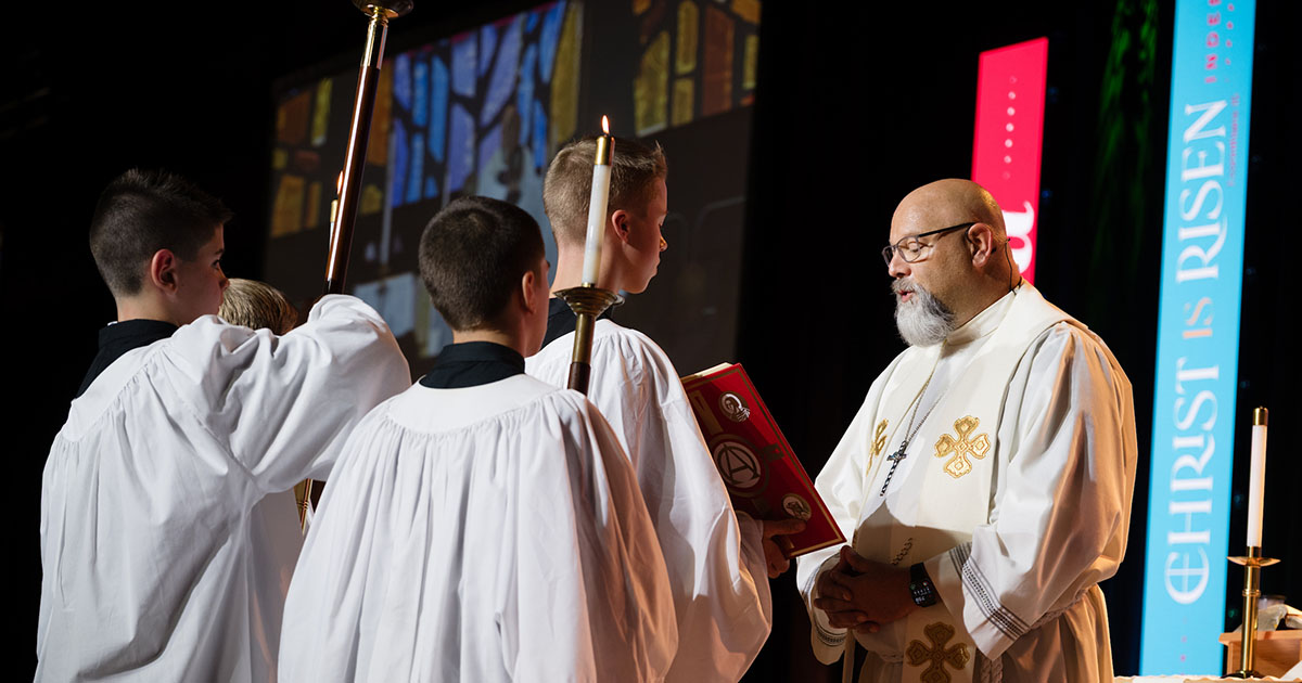 The Rev. Michael Kessler, pastor of Calvary Lutheran Church in Yuma, Ariz., reads the Gospel lesson during the Opening Divine Service of the 2026 LCMS convention in Phoenix on July 18. (LCMS/Frank Kohn)