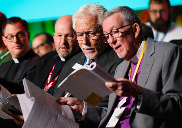 The Rev. Dr. Mike Gibson, president of the LCMS Pacific Southwest District, confers with the Rev. Dr. Scott Murray, outgoing LCMS third vice-president, as part of Floor Committee 6 on Pastoral Ministry and Seminaries during the 69th Regular Convention of The Lutheran Church—Missouri Synod in Phoenix on Monday, July 20. (LCMS/Erik M. Lunsford)