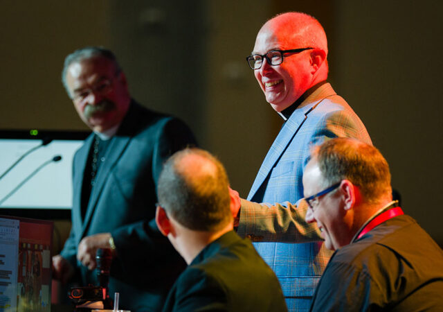 The Rev. Dr. John W. Sias shares a lighthearted moment with LCMS President Rev. Dr. Matthew C. Harrison during convention business on July 20. Sias was elected to a fourth term as Synod secretary. (LCMS/Erik M. Lunsford)